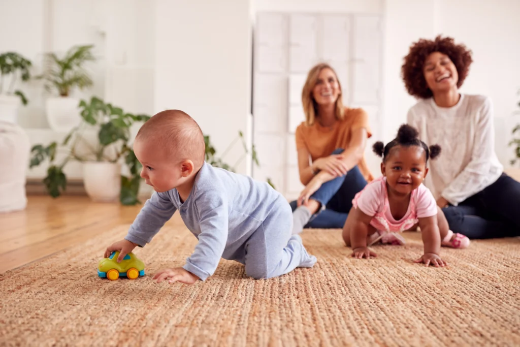 Toddler crawling during playtime at Dream Childcare in Kent, WA, under the supervision of experienced caregivers.